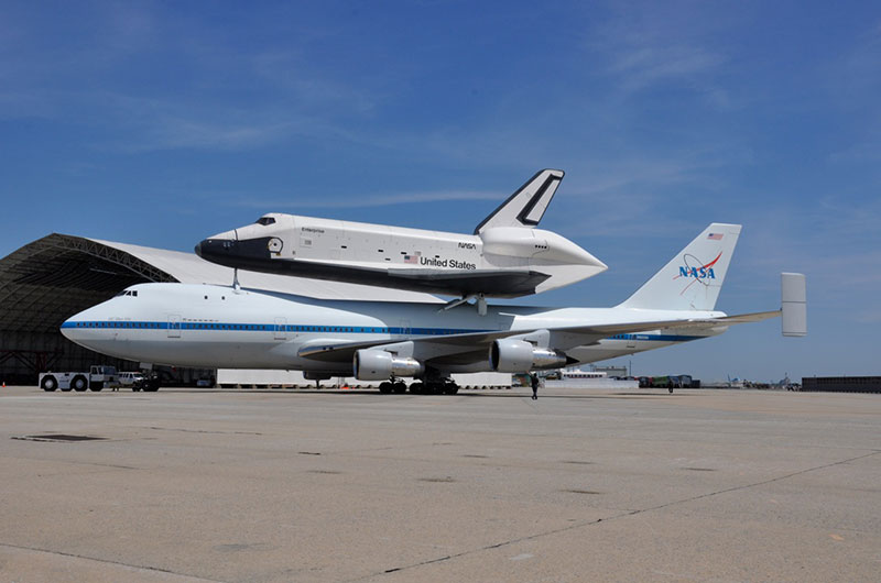 Space shuttle Enterprise hoisted off jumbo jet in New York