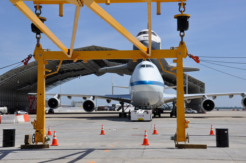 Space shuttle Enterprise hoisted off jumbo jet in New York