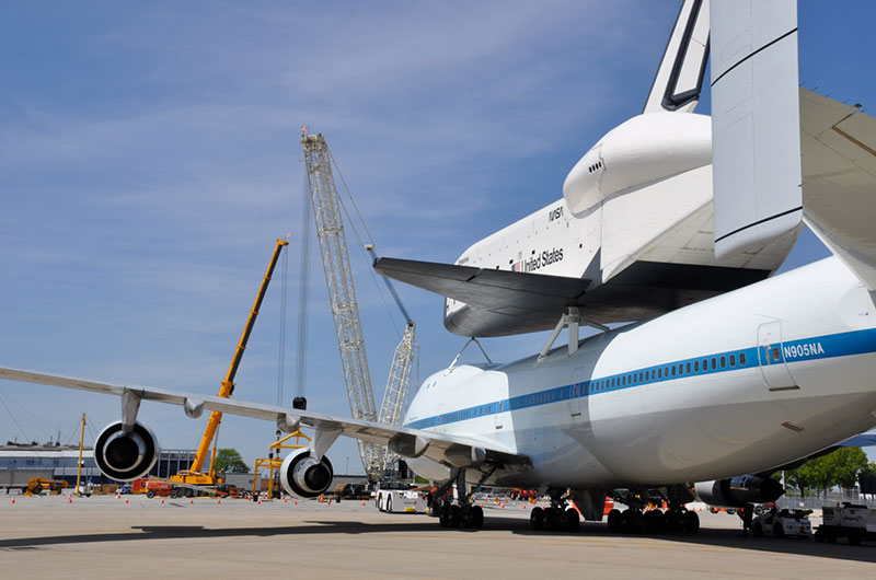 Space shuttle Enterprise hoisted off jumbo jet in New York