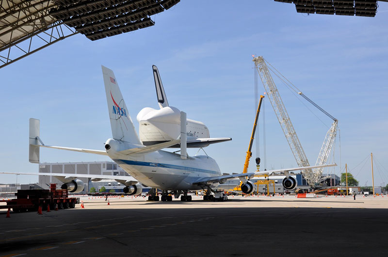 Space shuttle Enterprise hoisted off jumbo jet in New York