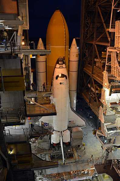 Final shuttle rolls out to launch pad as next-to-last lands