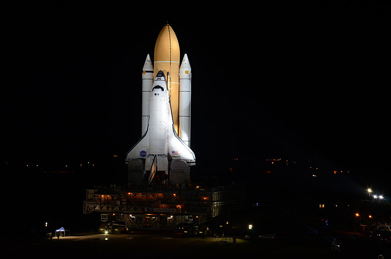 Final shuttle rolls out to launch pad as next-to-last lands