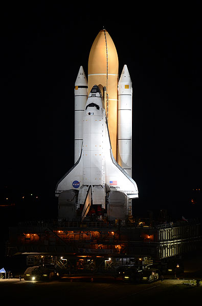 Final shuttle rolls out to launch pad as next-to-last lands